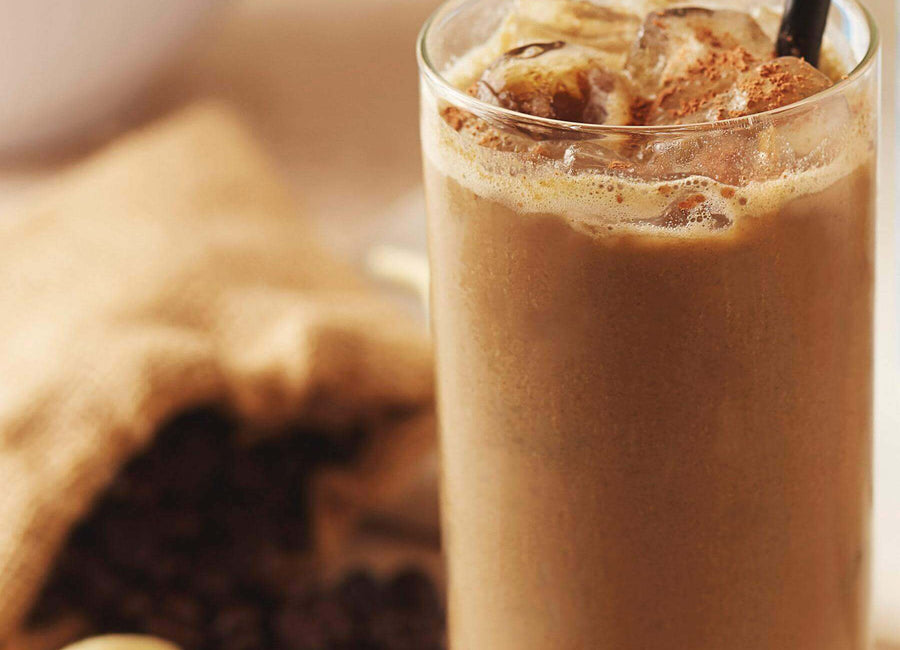 Tall glass of spicy iced mocha made with Navitas Organics Cacao Powder and Amazing Grass Vanilla Protein Powder