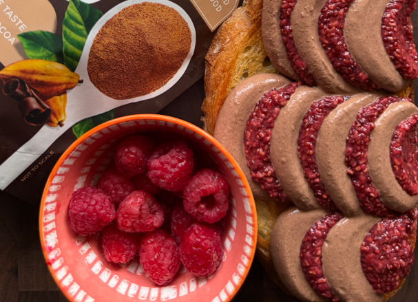 Chocolate mousse and raspberry jam made by Sara Fristoe with Navitas ORganics Cacao Powder and Chia Seeds spread on toast