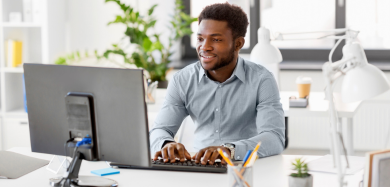 A middle-aged man working on a computer