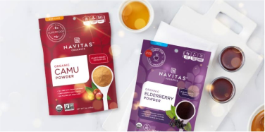 Navitas Organics Camu and Elderberry packages on a table of food