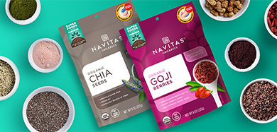 Navitas Organics Chia Seeds and Goji Berries with small dishes filled with various superfoods